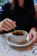 Woman holding a cup of coffee