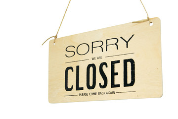 Sorry we're closed on wood hanging sign isolated on white.