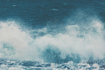 Fototapeta premium Waves and Rocks at Beach at Sunrise, 