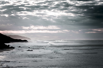 Waves and Rocks at Beach at Sunrise, 