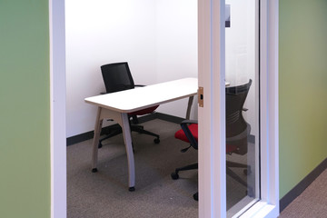small meeting table and chairs in the small meeting room