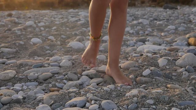 Child feet with beaded bracelet