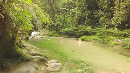 tena laguna azul ecuador - 14 april 2018: upper swimming pool at blue lagoon balneary with unknown people enjoying a peaceful weekend in tena laguna azul on april 14 2018 amazon rafting vacation kid