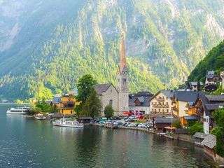 Fototapeta premium Scenic picture-postcard view of famous Hallstatt mountain village in the Austrian Alps at beautiful light in summer, Salzkammergut region, Hallstatt, Austria