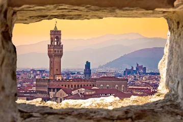 Foto op Canvas Ancient Florence cityscape and Palazzo Vecchio sunset view through stone window © xbrchx