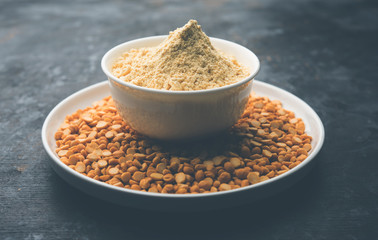 Besan, Gram or chickpea flour or powder is a pulse flour made from a variety of ground chickpea known as Bengal gram. popular ingredient for Pakora/pakoda or bajji snack. Selective focus