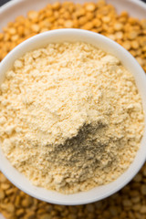 Besan, Gram or chickpea flour or powder is a pulse flour made from a variety of ground chickpea known as Bengal gram. popular ingredient for Pakora/pakoda or bajji snack. Selective focus
