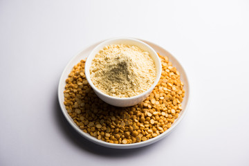 Besan, Gram or chickpea flour or powder is a pulse flour made from a variety of ground chickpea known as Bengal gram. popular ingredient for Pakora/pakoda or bajji snack. Selective focus