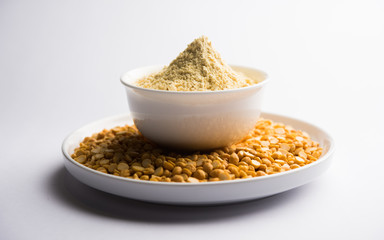 Besan, Gram or chickpea flour or powder is a pulse flour made from a variety of ground chickpea known as Bengal gram. popular ingredient for Pakora/pakoda or bajji snack. Selective focus