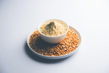 Besan, Gram or chickpea flour or powder is a pulse flour made from a variety of ground chickpea known as Bengal gram. popular ingredient for Pakora/pakoda or bajji snack. Selective focus