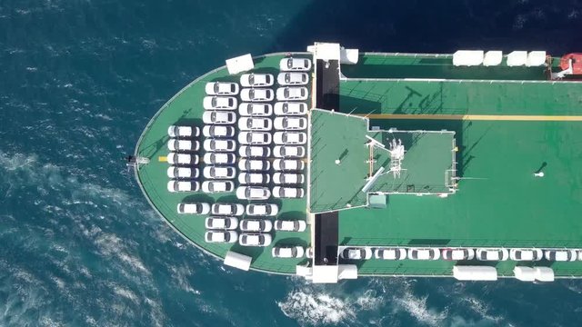 Aerial footage of a Large RoRo (Roll on/off) Vehicle carrie vessel cruising the Mediterranean sea