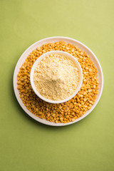 Besan, Gram or chickpea flour or powder is a pulse flour made from a variety of ground chickpea known as Bengal gram. popular ingredient for Pakora/pakoda or bajji snack. Selective focus
