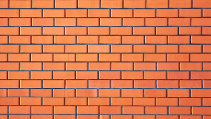 Wall from a red brick as an abstract background