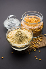Besan, Gram or chickpea flour or powder is a pulse flour made from a variety of ground chickpea known as Bengal gram. popular ingredient for Pakora/pakoda or bajji snack. Selective focus