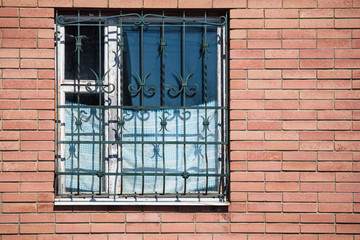 Window in the wall of red brick