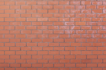 Wall from a red brick as an abstract background