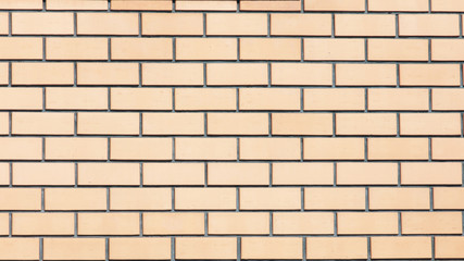 Yellow bricks in the wall as an abstract background