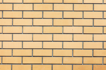 Yellow bricks in the wall as an abstract background