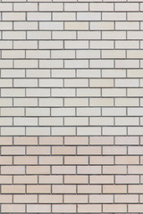 Yellow bricks in the wall as an abstract background