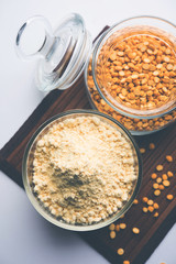 Besan, Gram or chickpea flour or powder is a pulse flour made from a variety of ground chickpea known as Bengal gram. popular ingredient for Pakora/pakoda or bajji snack. Selective focus