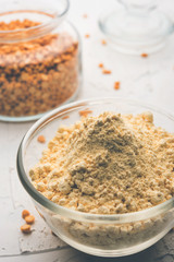 Besan, Gram or chickpea flour or powder is a pulse flour made from a variety of ground chickpea known as Bengal gram. popular ingredient for Pakora/pakoda or bajji snack. Selective focus