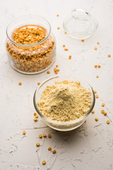 Besan, Gram or chickpea flour or powder is a pulse flour made from a variety of ground chickpea known as Bengal gram. popular ingredient for Pakora/pakoda or bajji snack. Selective focus