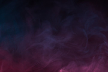 Colorful smoke close-up on a black background