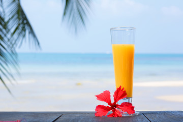 glass of juice with a view of the sea.