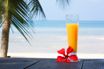 glass of juice with a view of the sea.