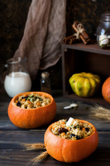 Millet porridge with raisins in pumpkin