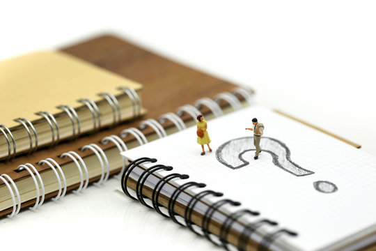 Miniature people : Businessman with THE QUESTION MARK using for concept Punctuation Day