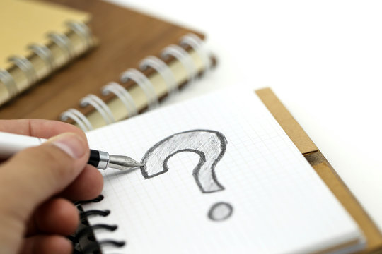 Miniature people : Businessman with THE QUESTION MARK using for concept Punctuation Day