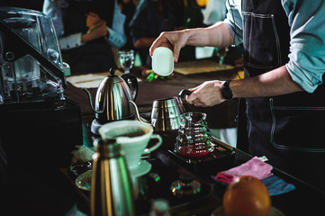 championship among coffee houses, members of teams show barista's skill, prepare drinks, teamwork