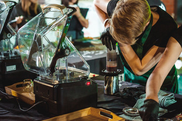 championship among coffee houses, members of teams show barista's skill, prepare drinks, teamwork