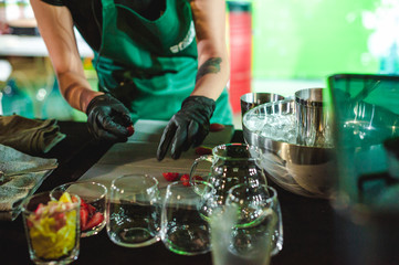 championship among coffee houses, members of teams show barista's skill, prepare drinks, teamwork