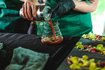 championship among coffee houses, members of teams show barista's skill, prepare drinks, teamwork
