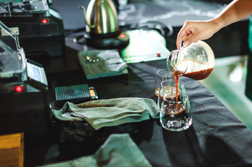 championship among coffee houses, members of teams show barista's skill, prepare drinks, teamwork