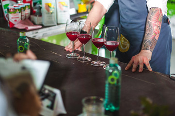 championship among coffee houses, members of teams show barista's skill, prepare drinks, teamwork