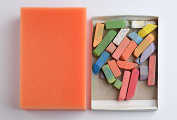 Pieces of chalk and sponge for chalkboard. School concept