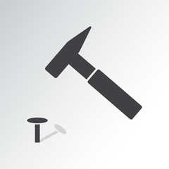 Hammer a nail. Black flat design. Vector illustration