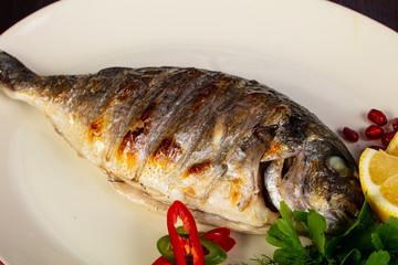 Grilled dorada served lemon
