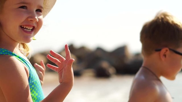 little girl smiling beach ocean