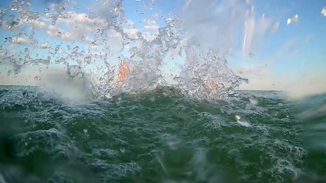  beach water splashing: young teens having summer beach party fun. slow mo stock video