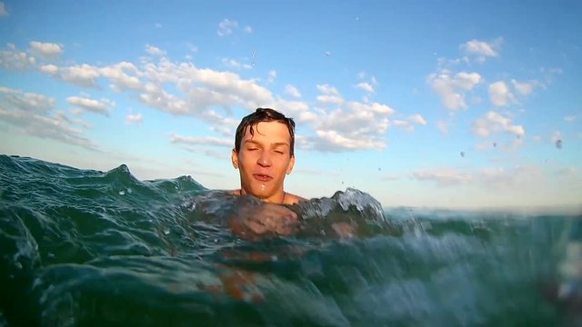  beach water splashing: young teens having summer beach party fun. slow mo stock video