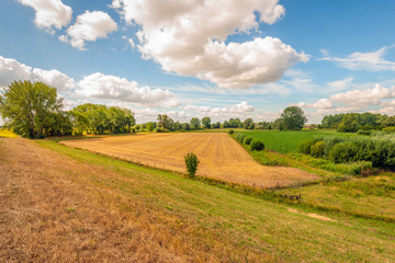 Fototapeta premium Colorful Dutch landscape with fascinatingly beautiful clouds