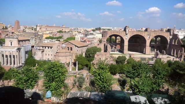 Pan view of Italian rooftops and palatino ruins, in capital city, Rome, on a sunny autumn day, in Italy