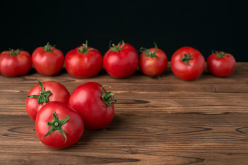 tomatoes on wooden background