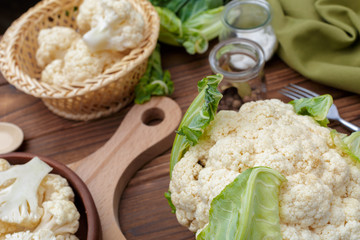 Organic cauliflower on wooden background