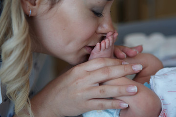 Portrait of a mother with her newborn baby