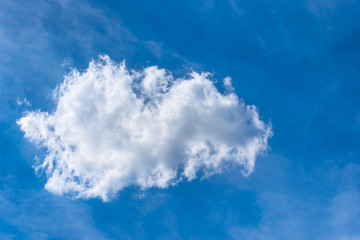 Fototapeta na wymiar One light beautiful cloud on a blue sky